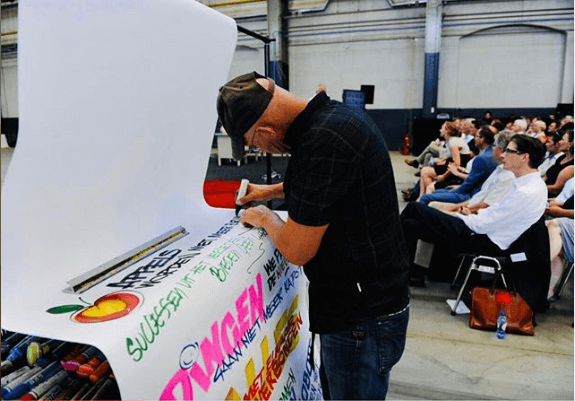 Henry Signpainter live in actie tijdens een corporate event