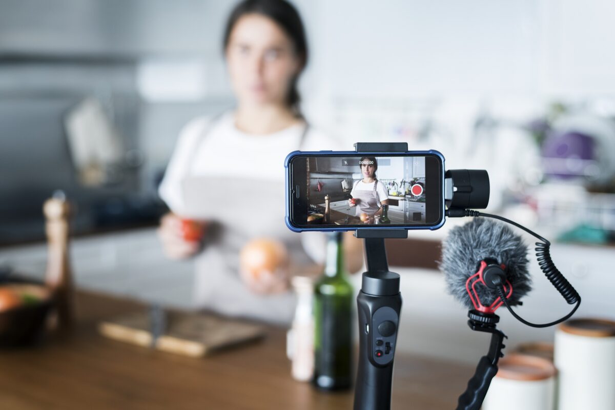 Female vlogger recording cooking related broadcast at home 24streamer